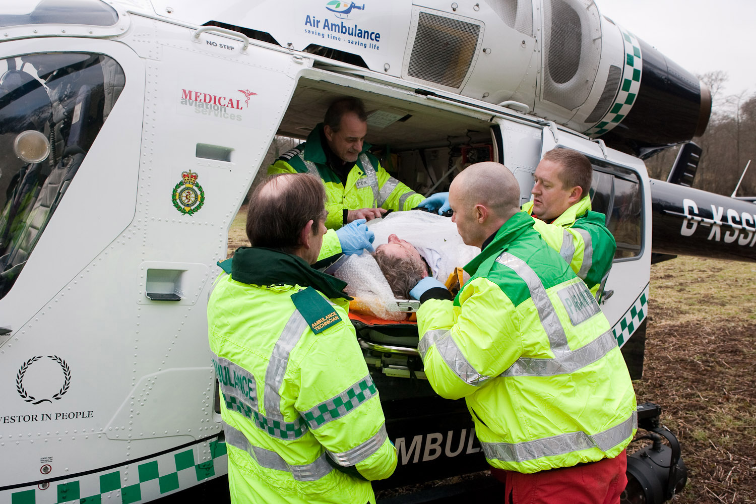 sussex air ambulance loading a patient from a CX race