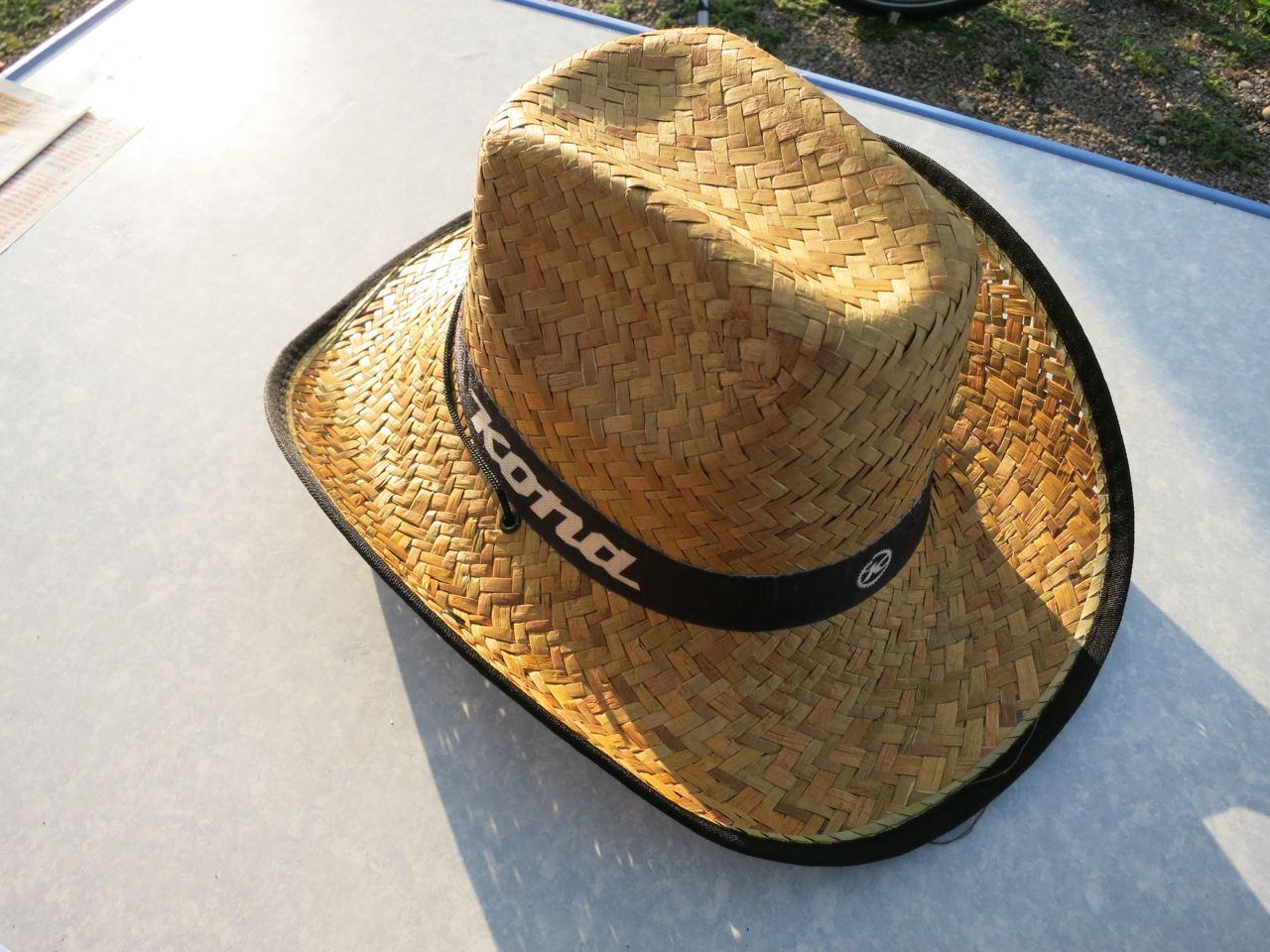 Kona's saloon booth demands cowboy hat wearing in return for a beer.