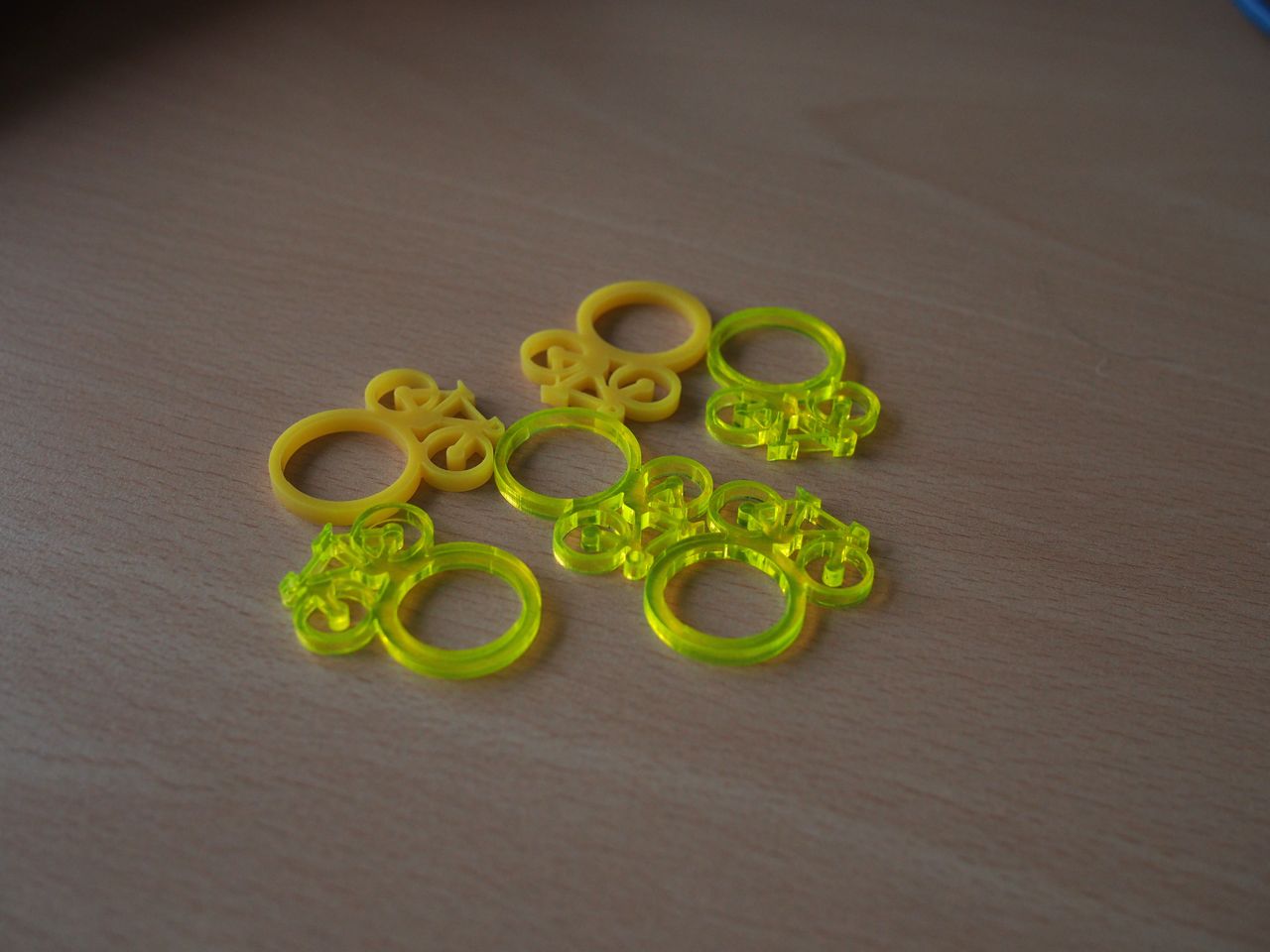 Tiny yellow bikes for your fingers