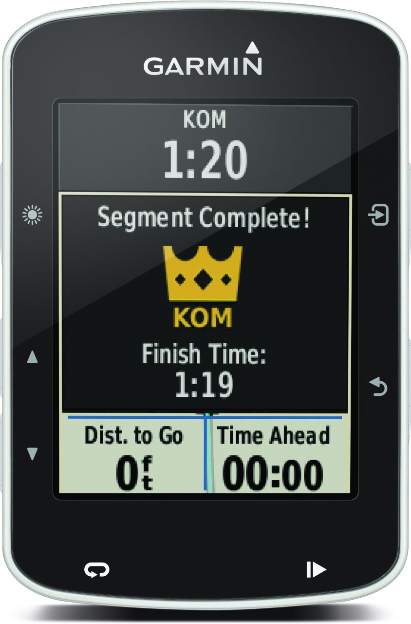Garmin device displaying a segment completion screen with a KOM achievement, showing segment time and finish time.