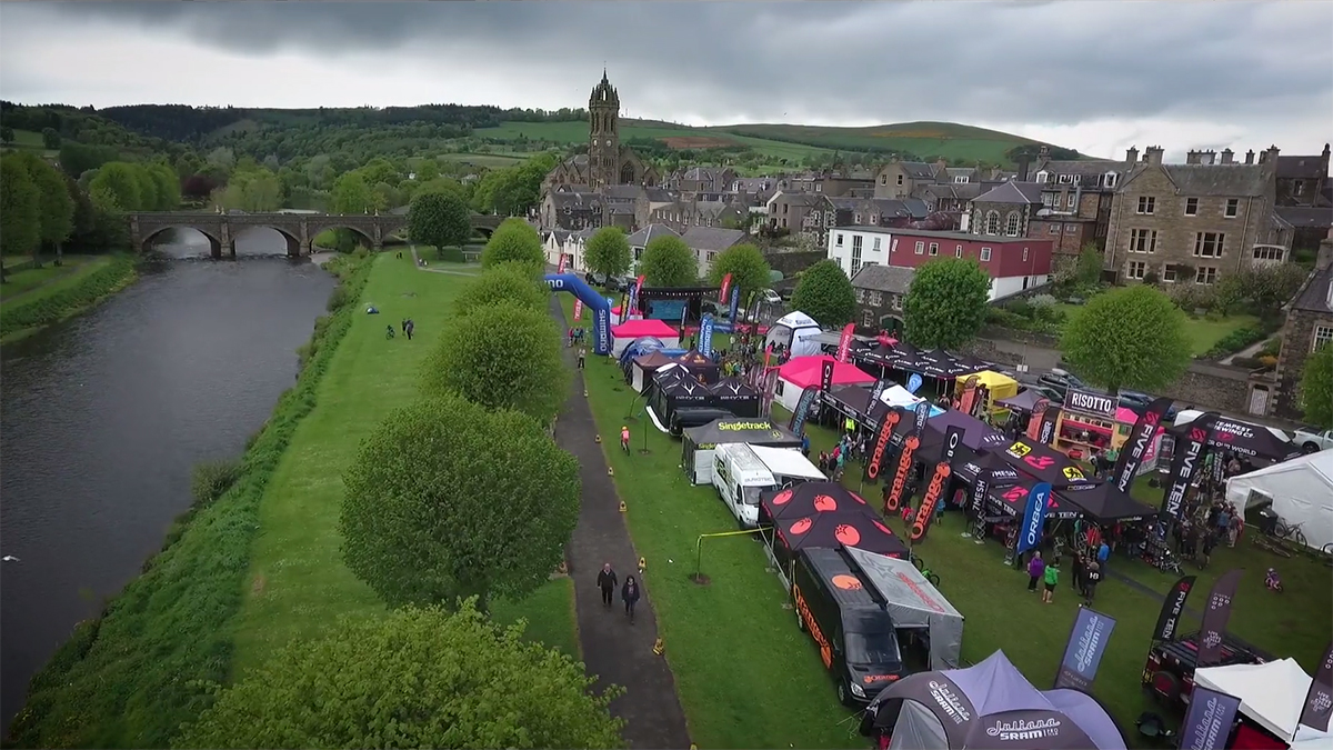 Who's under that black & lime tent?