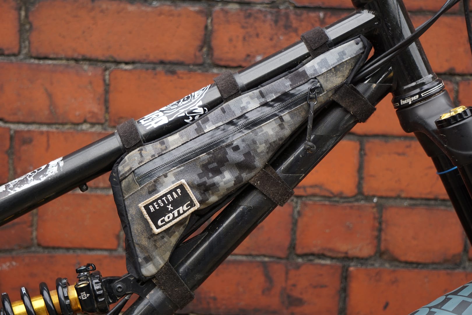 Rich uses his to carry a few trail essentials such as a single Pink Pedros tyre lever, inner tube, Fabric multi-tool, brass valve adapter for using petrol station pumps, red electrical tape, a BikeSure free Buff, a chain link and a Stanley Blade because “cutting tiptoes with teeth is well hard”.