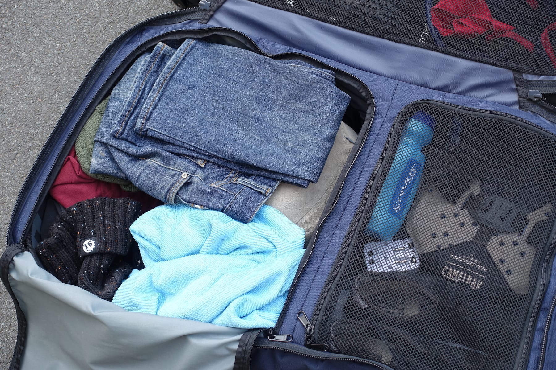 travel luggage jeans clothing towel