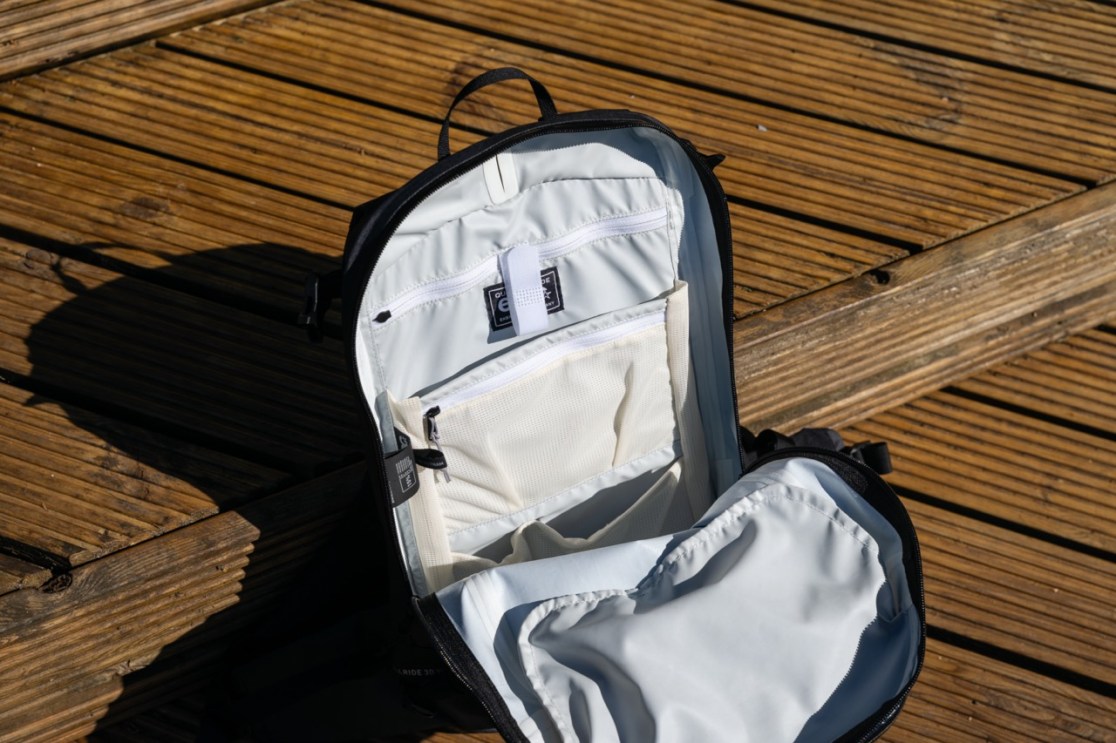 Interior view of the Evoc Allride 3D WP16 backpack showing organizational pockets and compartments.
