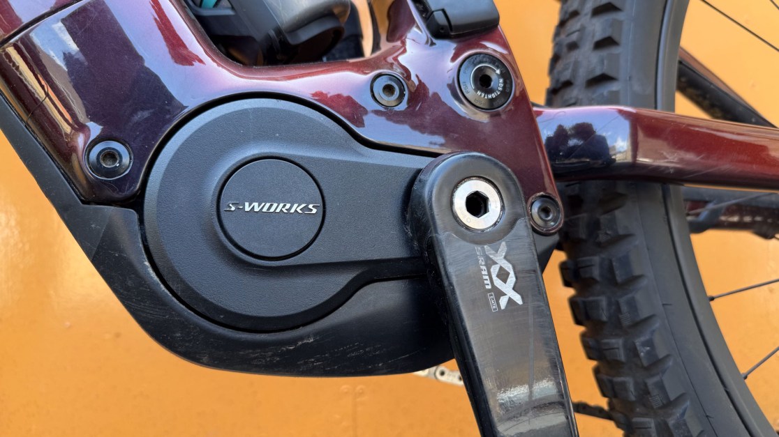 Close-up view of the S-Works motor and crankset on a mountain bike, showcasing its design and details.