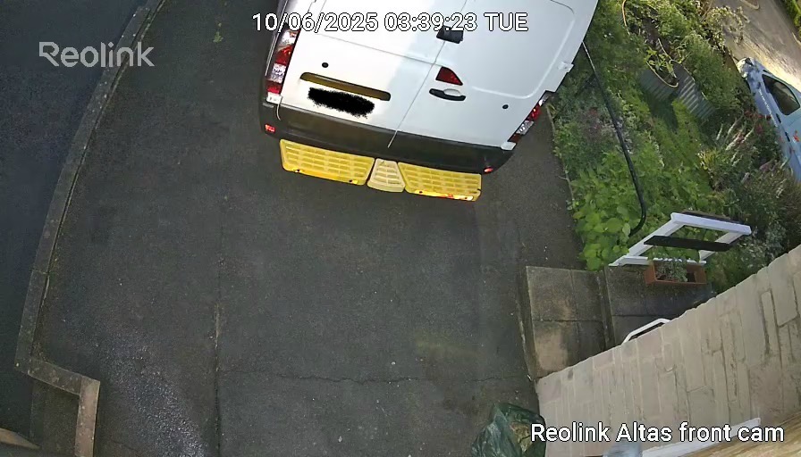 View from the Reolink Altas security camera showing a parked white van and surrounding area.