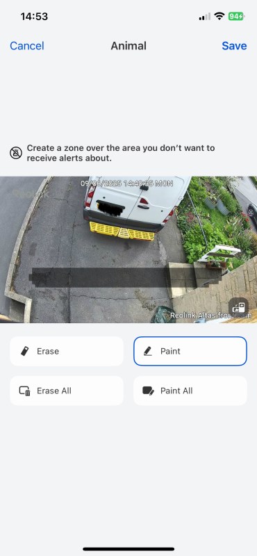 Screenshot of the Reolink Atlas app showing the option to create zones for motion alerts, with a vehicle visible in the monitored area.