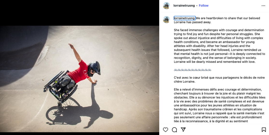 A person in a wheelchair performing a trick in a skatepark, wearing a helmet and a red shirt.
