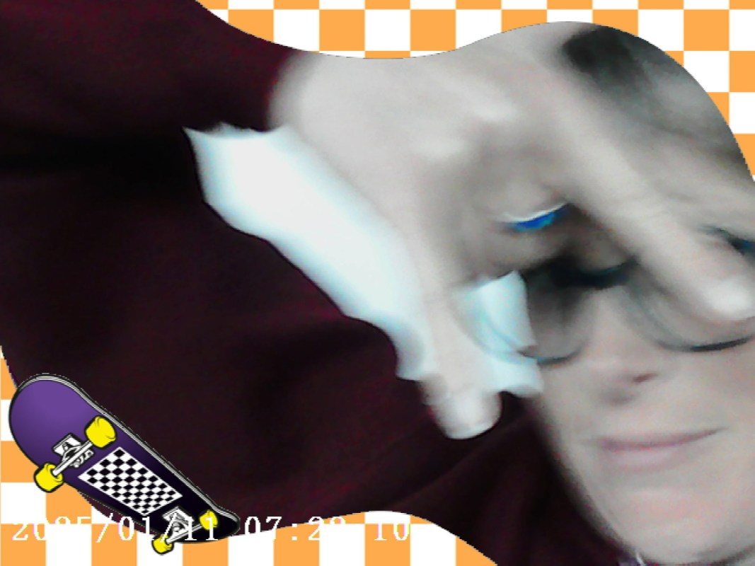 A person playfully making a gesture with their hand, wearing glasses, with a colorful background featuring a skateboard graphic.