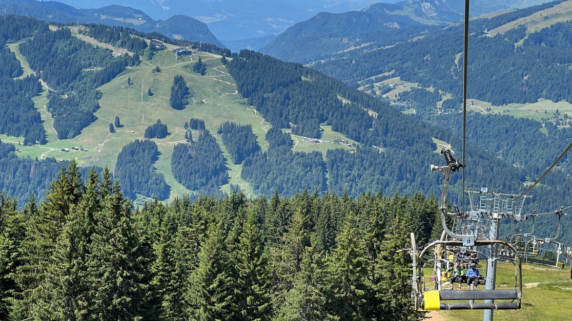 wide shot of landscape with cahirlift in the foreground