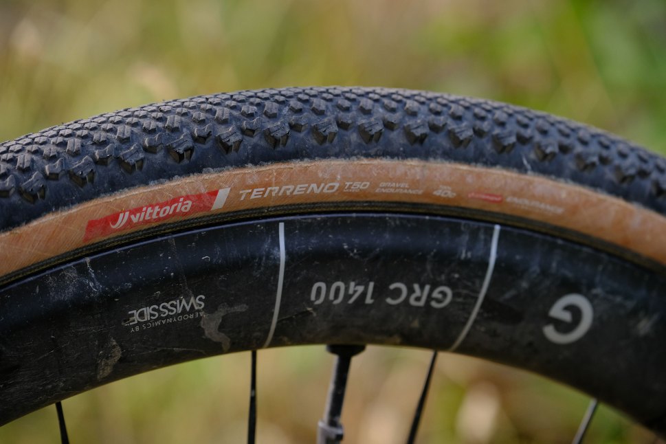 Close-up of a Vittoria Terreno T60 gravel bike tire showcasing its tread pattern and branding.