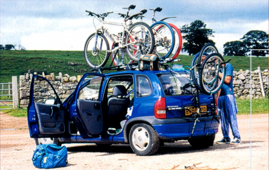 a vauxhall corsa circa 2000 loaded up with bikes